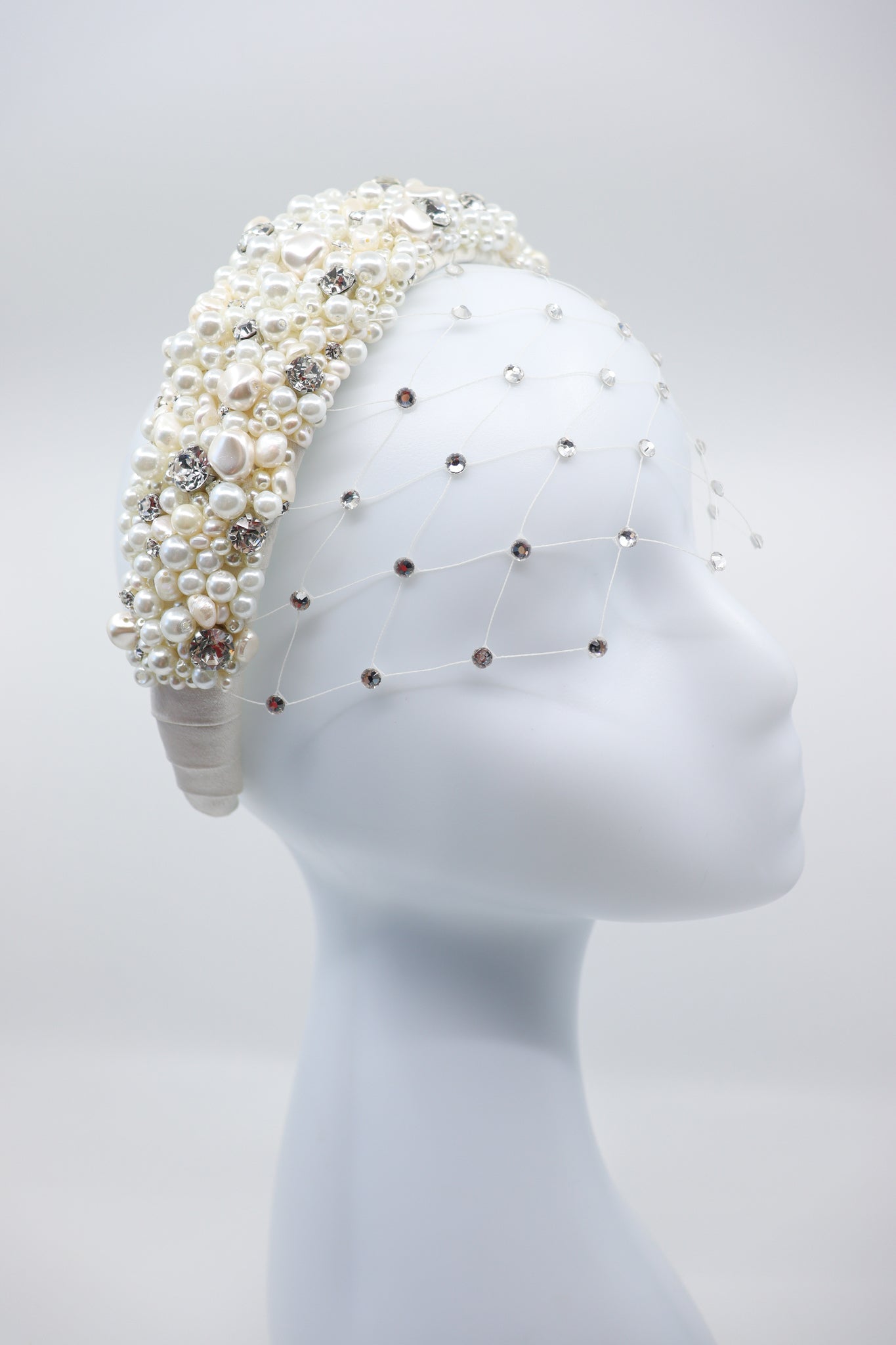Luna Wedding Headpiece by Eva Oherjus Design- Handcrafted bridal accessory with freshwater pearls, Swarovski crystals, and Italian silk. Perfect for elegant weddings.